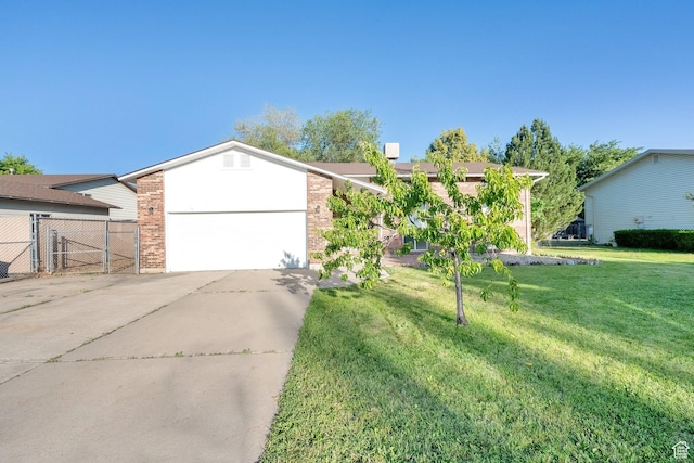45 W 900 S, Layton, UT 84041 - view of front of home with a garage, driveway, and brick siding