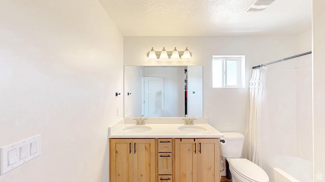 628 E 625 S, Nephi, UT 84648 - bathroom featuring double vanity, shower / tub combo with curtain, and a textured ceiling