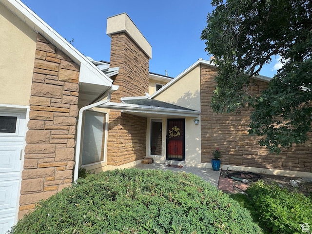 8463 S Jackson Hole Dr E, Sandy, UT 84093 - property entrance with stone siding