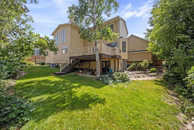 8463 S Jackson Hole Dr E, Sandy, UT 84093 - back of property with stairway, a deck, and a chimney