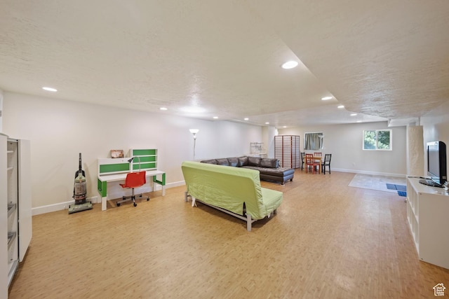 8463 S Jackson Hole Dr E, Sandy, UT 84093 - living room with light wood-type flooring, recessed lighting, and a textured ceiling
