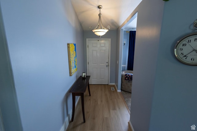 8298 S Festive Way, West Jordan, UT 84088 - doorway to outside with light wood-style flooring and baseboards