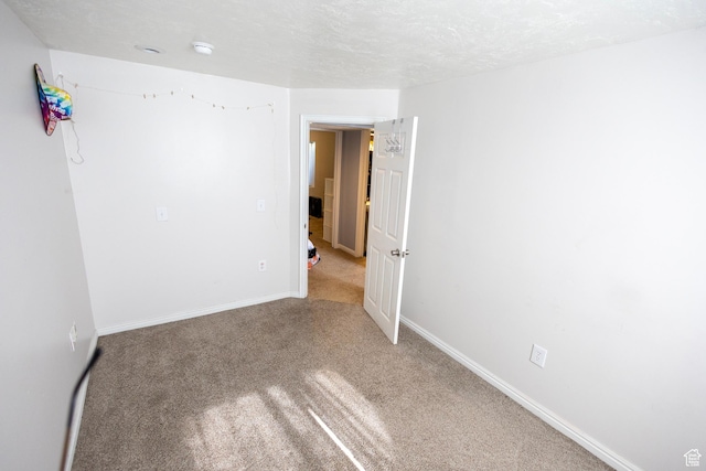 8298 S Festive Way, West Jordan, UT 84088 - empty room featuring carpet flooring and baseboards