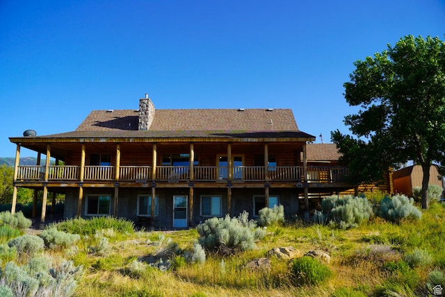 11495 E 16000 N, Mount Pleasant, UT 84647 - rear view of property featuring a chimney, log exterior, a wooden deck, and roof with shingles