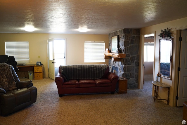 11495 E 16000 N, Mount Pleasant, UT 84647 - carpeted living area with healthy amount of natural light, a textured ceiling, and a stone fireplace