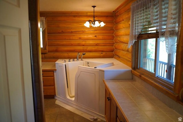 11495 E 16000 N, Mount Pleasant, UT 84647 - laundry area featuring rustic walls, washer and clothes dryer, a chandelier, and tile patterned floors