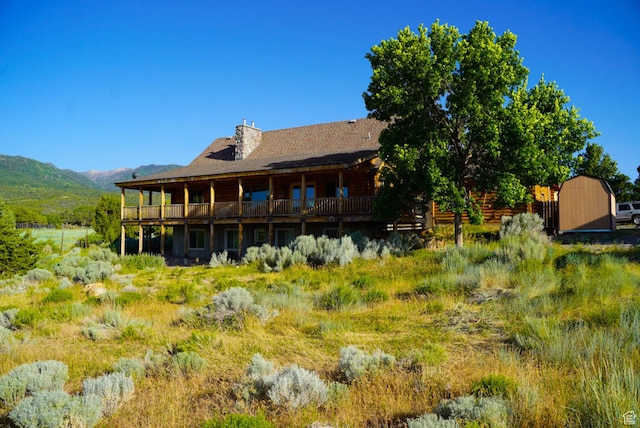 11495 E 16000 N, Mount Pleasant, UT 84647 - back of property with a storage shed, a deck with mountain view, and a chimney