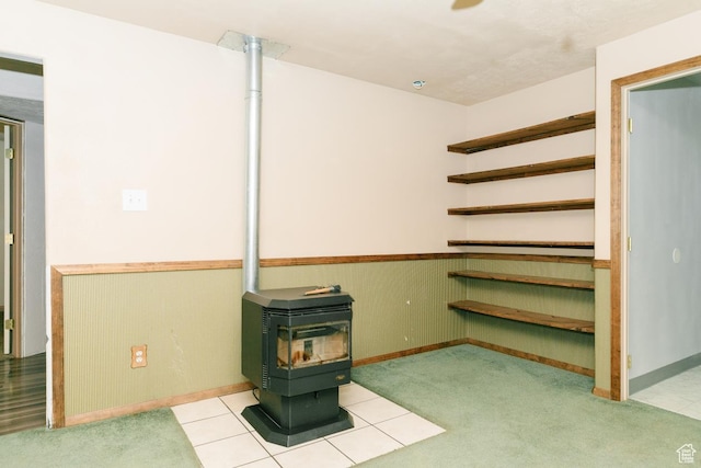 3229 E Riverdale Rd, Preston, ID 83263 - basement with a wood stove and a wainscoted wall