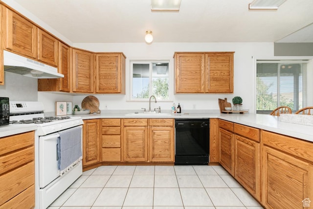 3229 E Riverdale Rd, Preston, ID 83263 - kitchen featuring dishwasher, white gas range, under cabinet range hood, light countertops, and light tile patterned floors