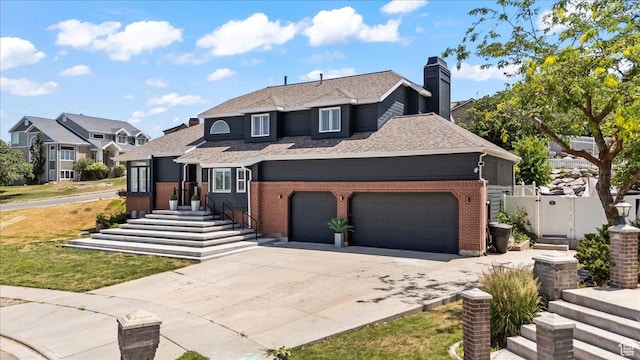 4104 S Bridlewood Dr E, Bountiful, UT 84010 - traditional home with concrete driveway, a garage, a chimney, brick siding, and a gate
