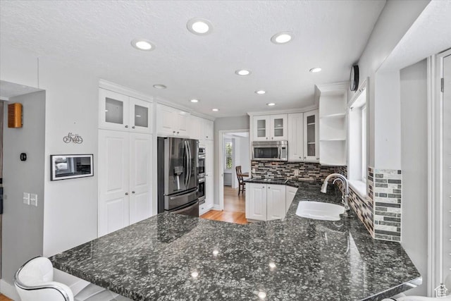 4104 S Bridlewood Dr E, Bountiful, UT 84010 - kitchen with appliances with stainless steel finishes, a peninsula, open shelves, white cabinets, and recessed lighting