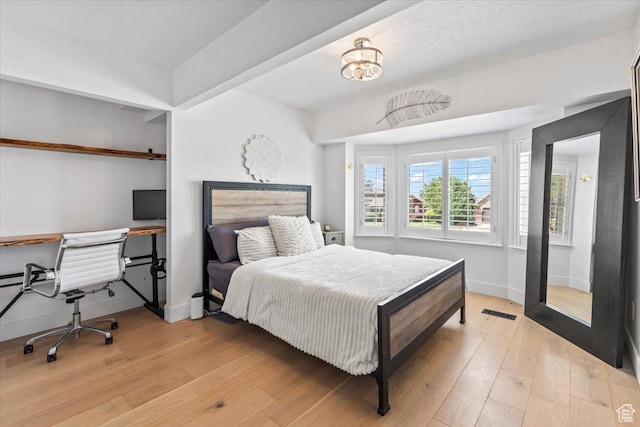 4104 S Bridlewood Dr E, Bountiful, UT 84010 - bedroom with light wood-type flooring and a desk