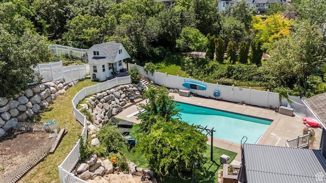 4104 S Bridlewood Dr E, Bountiful, UT 84010 - view of pool featuring a fenced backyard, an outdoor structure, a patio area, and an exterior structure