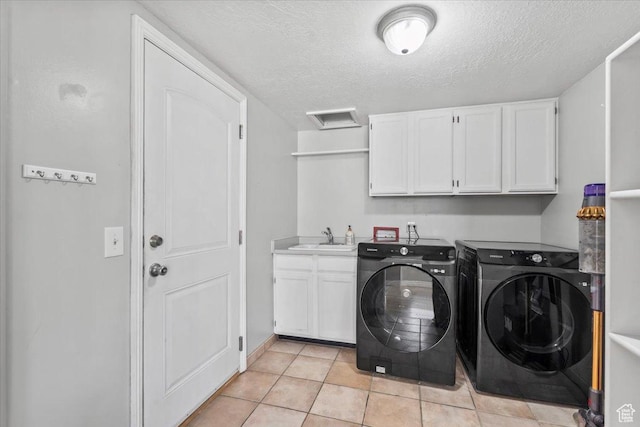 4104 S Bridlewood Dr E, Bountiful, UT 84010 - laundry area with cabinet space, washer and dryer, attic access, a textured ceiling, and light tile patterned floors