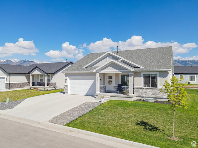 536 N 770 W, Smithfield, UT 84335 - ranch-style home featuring stone siding, covered porch, stucco siding, a front yard, and roof with shingles