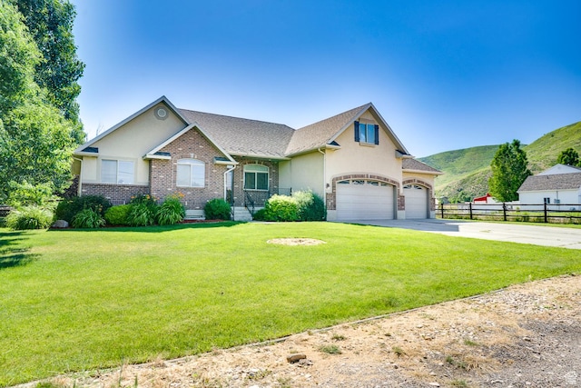 3035 S Big Hollow Rd, Heber City, UT 84032 - view of front of property featuring driveway, an attached garage, brick siding, stucco siding, and a mountain view