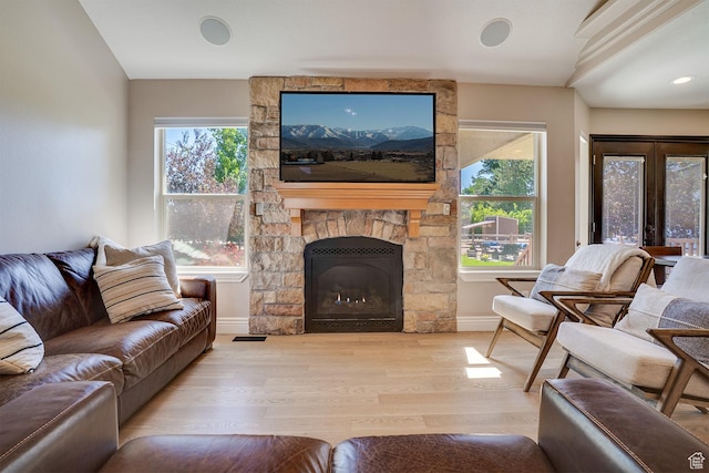 3035 S Big Hollow Rd, Heber City, UT 84032 - living area featuring wood finished floors, plenty of natural light, and a fireplace