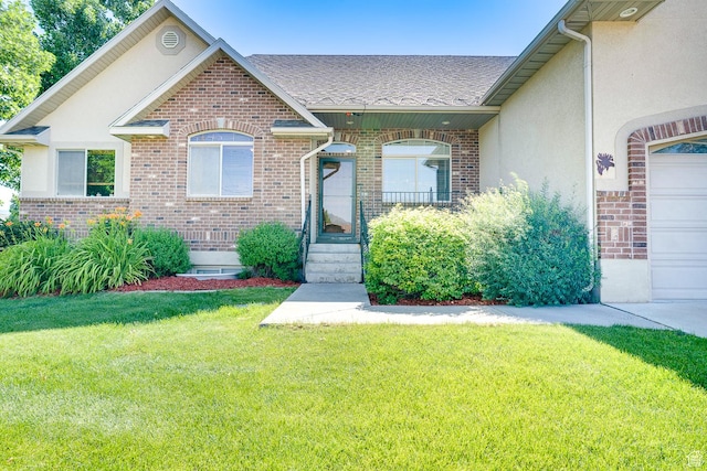3035 S Big Hollow Rd, Heber City, UT 84032 - view of front of home featuring brick siding, a front lawn, a shingled roof, and stucco siding
