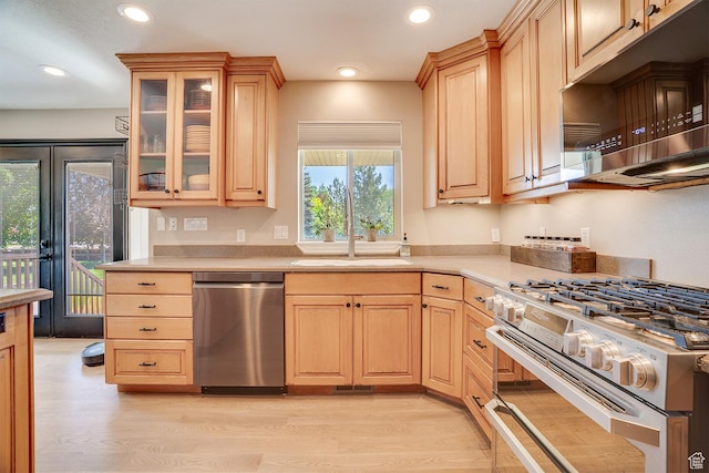3035 S Big Hollow Rd, Heber City, UT 84032 - kitchen with stainless steel appliances, light countertops, light brown cabinetry, recessed lighting, and light wood-type flooring