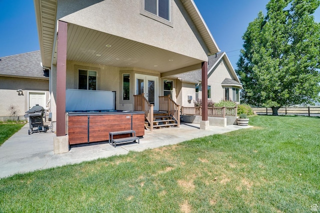 3035 S Big Hollow Rd, Heber City, UT 84032 - back of property with a hot tub, a patio, stucco siding, and french doors