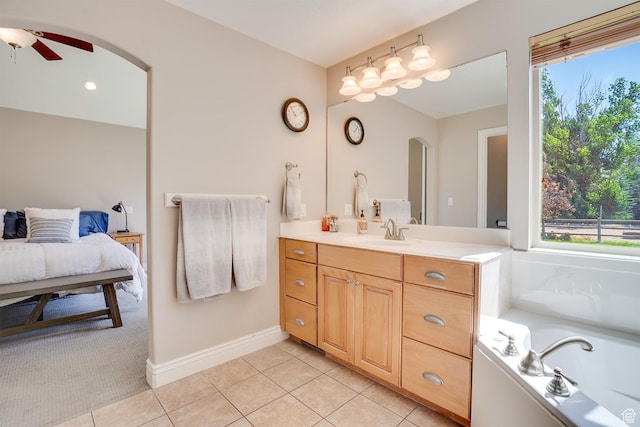 3035 S Big Hollow Rd, Heber City, UT 84032 - full bath with vanity, ceiling fan, tile patterned floors, a tub to relax in, and connected bathroom