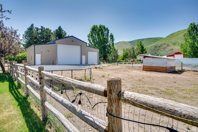 3035 S Big Hollow Rd, Heber City, UT 84032 - view of yard with a garage, a mountain view, and an outdoor structure