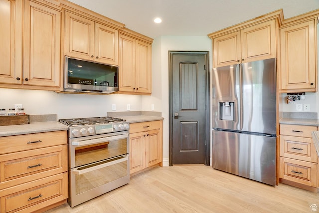 3035 S Big Hollow Rd, Heber City, UT 84032 - kitchen featuring stainless steel appliances, light brown cabinets, light wood-style floors, light countertops, and recessed lighting