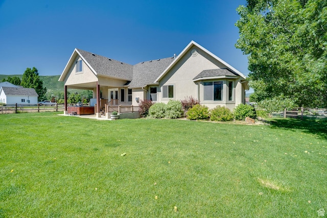 3035 S Big Hollow Rd, Heber City, UT 84032 - rear view of house with stucco siding, a deck, a patio, and roof with shingles