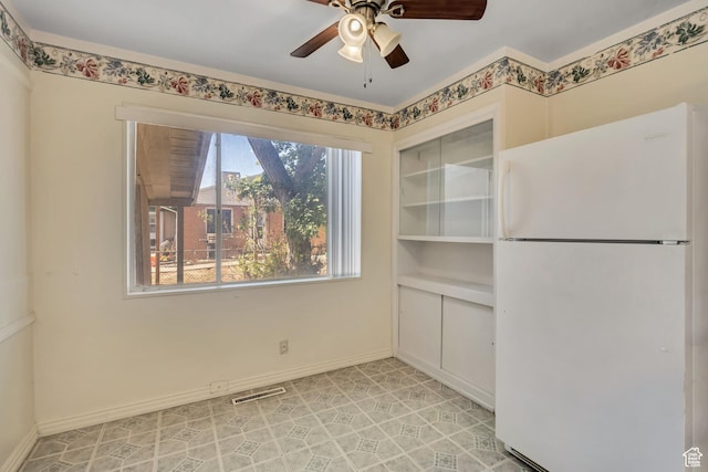 3409 S Maple Way, Salt Lake City, UT 84119 - unfurnished dining area featuring ceiling fan and baseboards