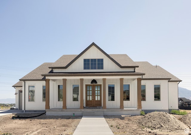 14277 S Keely Ct, Bluffdale, UT 84065 - modern inspired farmhouse with covered porch, board and batten siding, french doors, a shingled roof, and brick siding