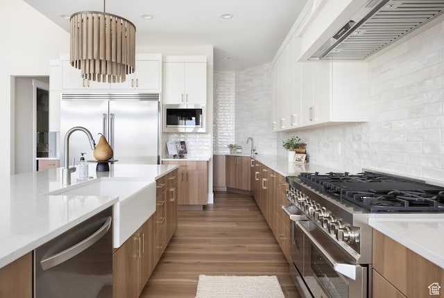 14277 S Keely Ct, Bluffdale, UT 84065 - kitchen with built in appliances, premium range hood, modern cabinets, light wood-style floors, and recessed lighting