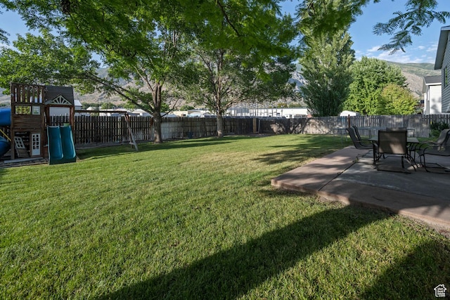 318 W 850 N, Springville, UT 84663 - fenced backyard with a patio and a playground