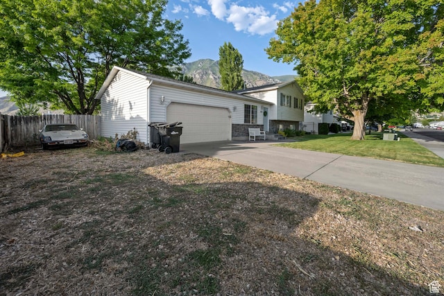 318 W 850 N, Springville, UT 84663 - split level home with a garage, a mountain view, and concrete driveway