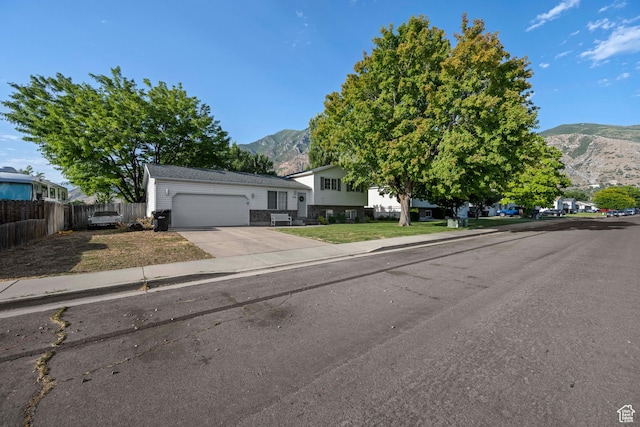 318 W 850 N, Springville, UT 84663 - tri-level home featuring a mountain view, an attached garage, and concrete driveway