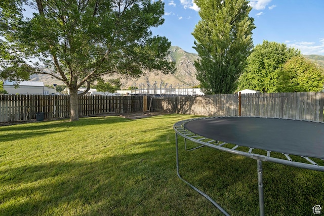 318 W 850 N, Springville, UT 84663 - fenced backyard featuring a trampoline and a mountain view