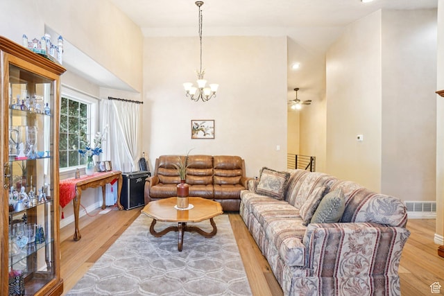 798 E Spruce Tree Ln, Sandy, UT 84094 - living area with a chandelier and light wood-style floors