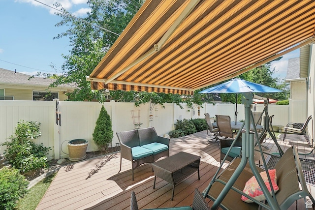 798 E Spruce Tree Ln, Sandy, UT 84094 - wooden deck with a fenced backyard, outdoor lounge area, and outdoor dining space