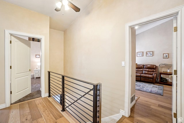 798 E Spruce Tree Ln, Sandy, UT 84094 - hallway featuring an upstairs landing, light wood-style flooring, and vaulted ceiling