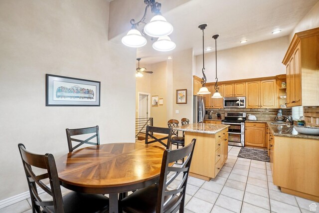 798 E Spruce Tree Ln, Sandy, UT 84094 - dining space featuring a towering ceiling, light tile patterned floors, and a ceiling fan