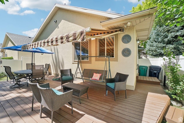 798 E Spruce Tree Ln, Sandy, UT 84094 - wooden terrace featuring a fenced backyard, outdoor dining area, and an outdoor hangout area