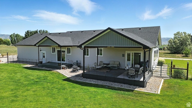 968 S 5400 W, Malad City, ID 83252 - rear view of property with a shingled roof, an outdoor hangout area, a deck with mountain view, and a patio