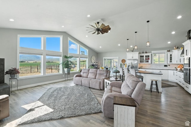 968 S 5400 W, Malad City, ID 83252 - living room featuring vaulted ceiling, recessed lighting, ceiling fan, and dark wood-type flooring