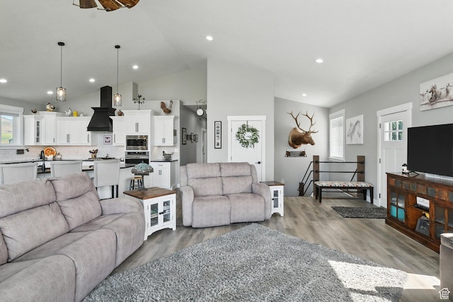 968 S 5400 W, Malad City, ID 83252 - living area featuring light wood-type flooring, recessed lighting, high vaulted ceiling, and ceiling fan