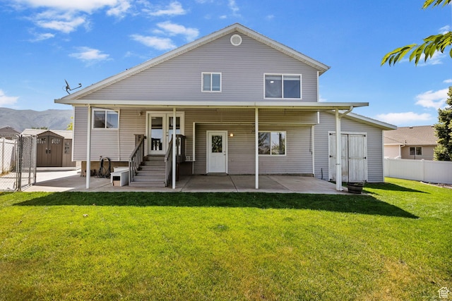 2177 N 125 W, Layton, UT 84041 - rear view of property featuring a storage unit, a patio area, and a mountain view