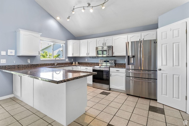 2177 N 125 W, Layton, UT 84041 - kitchen with appliances with stainless steel finishes, a peninsula, white cabinetry, light tile patterned flooring, and high vaulted ceiling