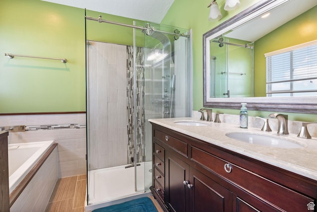 2177 N 125 W, Layton, UT 84041 - full bathroom featuring a shower stall, a garden tub, double vanity, and tile walls