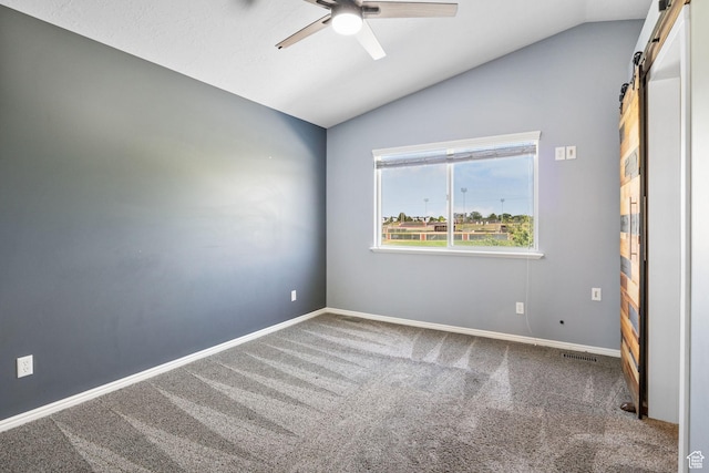 2177 N 125 W, Layton, UT 84041 - unfurnished room with a barn door, vaulted ceiling, a ceiling fan, and carpet