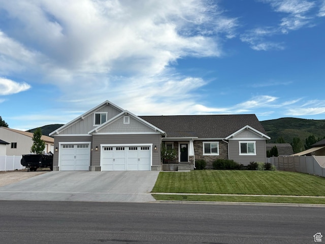 966 E 2810 S, Heber City, UT 84032 - craftsman-style house featuring an attached garage, concrete driveway, stone siding, and a mountain view