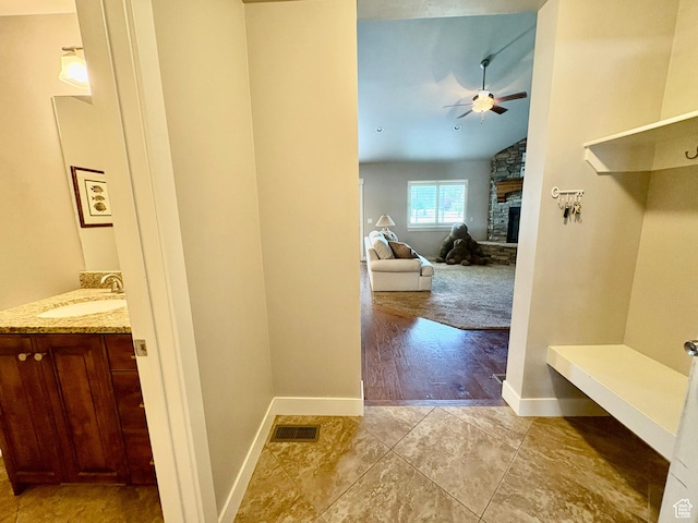 966 E 2810 S, Heber City, UT 84032 - mudroom featuring a ceiling fan, a fireplace, vaulted ceiling, and light tile patterned floors
