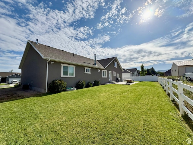 966 E 2810 S, Heber City, UT 84032 - back of property with a patio area, stucco siding, and roof with shingles